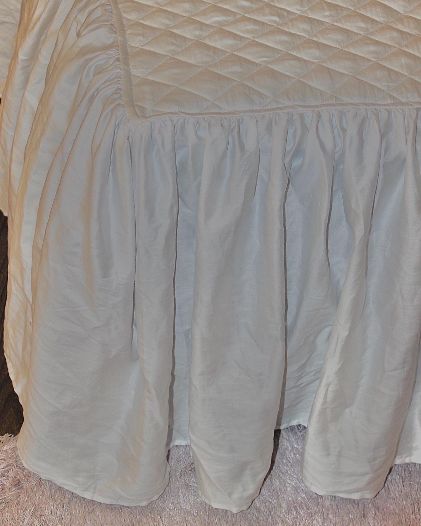 Satin quilted frill bedcover